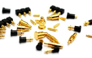 Close-up of pogo pin connectors showing spring-loaded contact mechanism in electronic devices